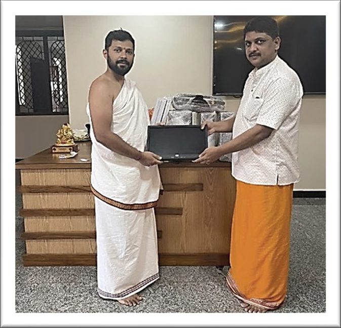 A computer being handed over to a gurukul