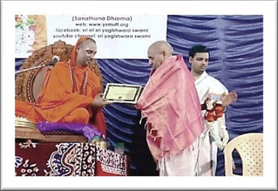 Sri Yogi felicitating a scholar
