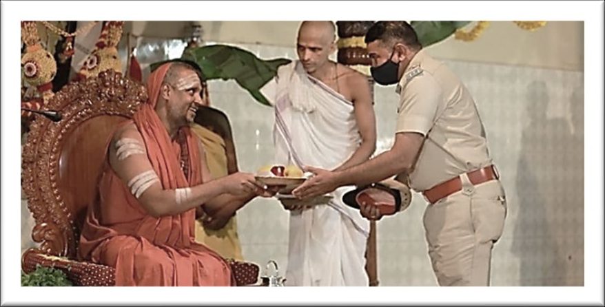 A distinguished guest being felicitated