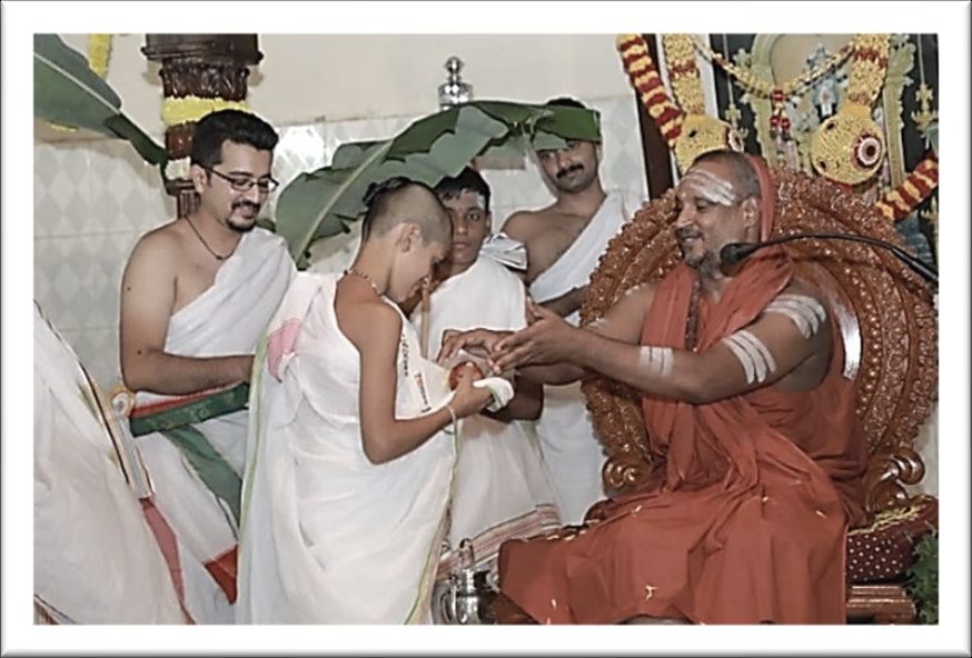 A young graduate receiving blessings from Sri Yogi