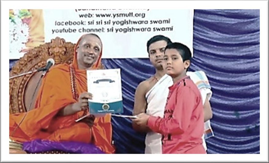 A student receiving a scholarship from Sri Yogi