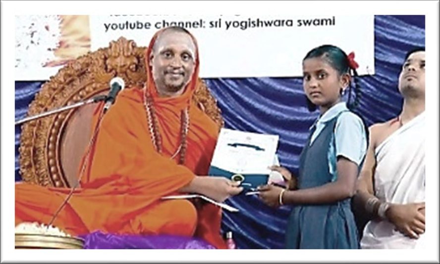 A schoolgirl receiving a scholarship from Sri Yogi